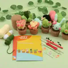 Colorful crocheted plant pot plush toys on green background, DIY succulent crochet kit, ideal for home decor, gifting, and crafting at Monalisa Store.