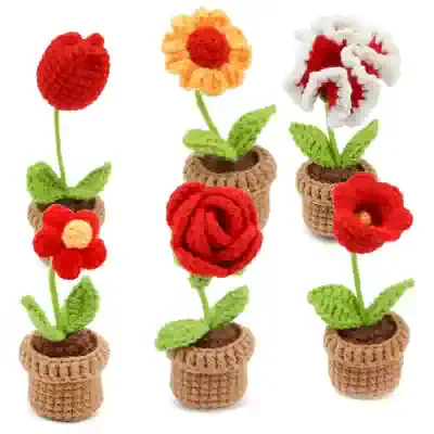 Colorful crochet flower set in small pots, perfect for home decor and gifts, handmade with durable yarn, vibrant flowers with green leaves, enhances any space with cheerful floral accents.