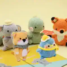 Colorful handmade crochet animal plush toys at Monalisa Store, perfect for gifts and home decor, including elephants, foxes, and birds, showcasing high-quality craftsmanship and adorable designs.