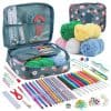 Colorful knitting and crochet starter kit with yarn, tools, and accessories in floral-printed case for DIY craft projects.