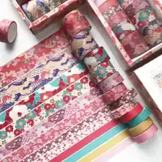 Colorful Japanese washi tapes and decorative masking tapes with floral and traditional patterns, ideal for scrapbooking, crafts, and journaling projects.