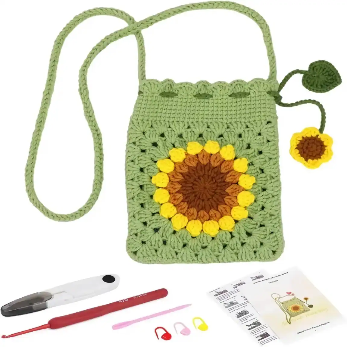 Colorful sunflower crochet bag with a yellow, brown, and green flower design, accompanied by a crochet hook, scissors, and instructional pattern sheet, perfect for handmade accessories or craft projects.