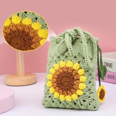 Bright handmade crochet sunflower tote bag in pastel green, perfect for stylish accessories. Unique sunflower design adds cheerful charm to your outfit, ideal for casual or summer occasions.