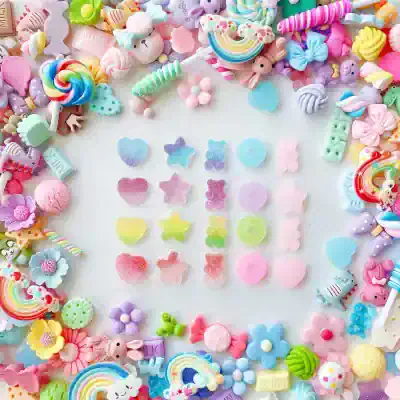 Colorful collection of gummy candies, candies, and sweets arranged in a decorative border for adorable and sweet-themed aesthetic.
