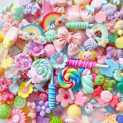 Colorful collection of cute children's toys, sweets, and accessories, perfect for kids' fashion and playful decor, featuring pastel and vibrant colors, rainbow motifs, and whimsical designs.