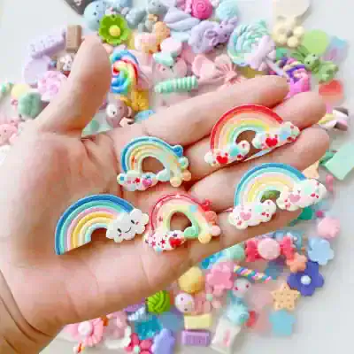 Colorful rainbow and cloud hair clips with cute, playful designs perfect for kids' accessories and children's hair decor.