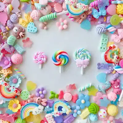 Bright pastel gummy candies and lollipops arranged in a colorful, playful border, perfect for a cute, fun-themed online store focusing on sweet treats and adorable accessories.