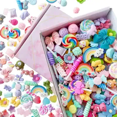 Colorful assortment of cute and playful candies in a pink gift box, featuring lollipops, gummies, and sweets with pastel colors, perfect for enhancing children's oral health and dental care products.