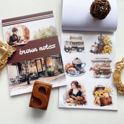 Vintage cafe illustrations and brown notes stationery set with gold frame accents for stylish office decor and creativity.
