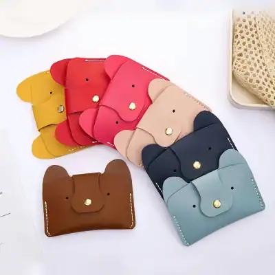 Mini elephant-shaped leather wallets in various colors, perfect for stylish accessories or gift ideas, featuring a simple snap closure and vibrant pastel or earthy tones.