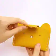 Yellow leather eyeglass case for optical glasses, stylish and compact, perfect for Monalisa Store optical eyewear collection.