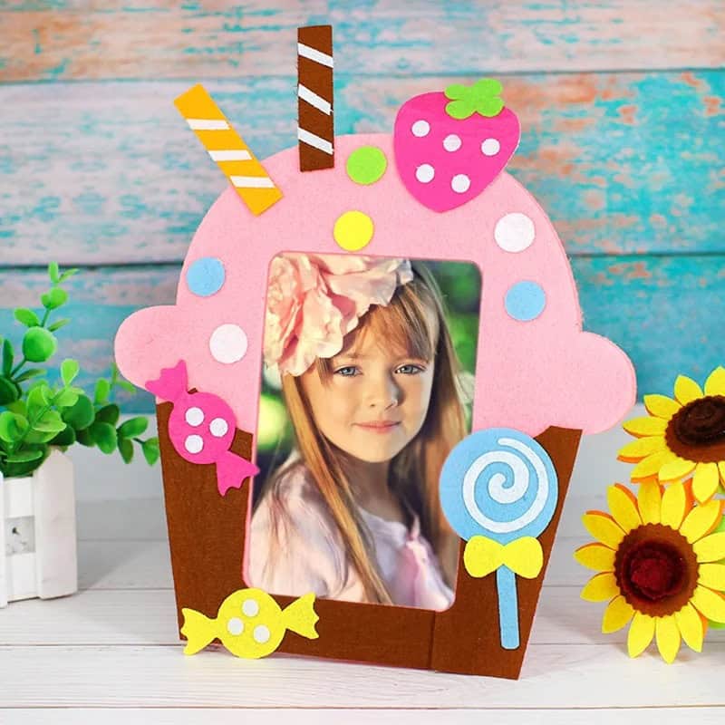 Colorful ice cream-themed photo frame with strawberries, candies, and lollipops, perfect for children's photos. Bright, playful design suitable for kids' events and photo displays.