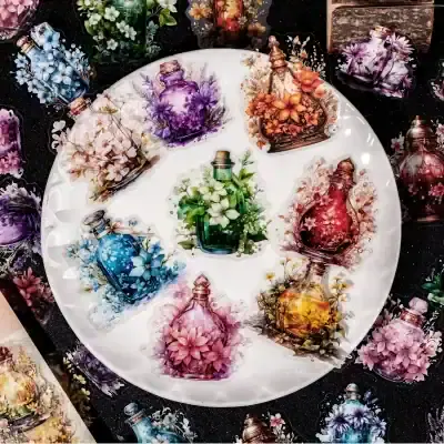 Vibrant glass perfume bottles with floral designs on a white plate, perfect for elegant decor or gifting, showcased at Monalisa Store.