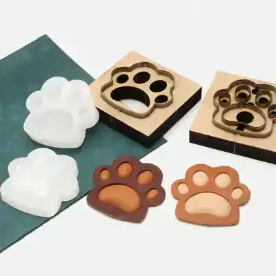 Paw-shaped silicone mold and cutters for pet-themed crafts, ideal for making dog and cat paw treats, jewelry, or soap, available at Monalisa Medical Store.