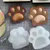 Paw-shaped molds and soaps, perfect for creating playful and animal-themed soap designs for pet lovers and pet salons, with a focus on unique soap crafting.