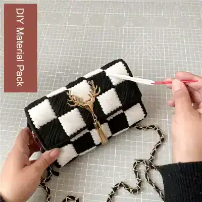 Black and white checkered DIY material purse with deer charm and chain strap, crafted for stylish accessorizing, ideal for personal use or gifts, perfect for fashion-forward individuals and handbag enthusiasts.