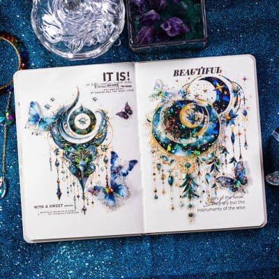Intricate jewelry-inspired art with celestial motifs, butterflies, and shimmering embellishments, displayed in a creative sketchbook on a glittery blue background, highlighting Monalisa Store's artistic jewelry designs.