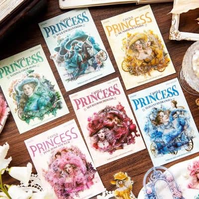 Colorful princess-themed stationery and stickers featuring various princess illustrations on wooden surface at Monalisa Store.