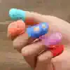 Colorful silicone finger protectors for improved grip in healthcare and optical work, designed to keep fingers safe and clean during delicate tasks.