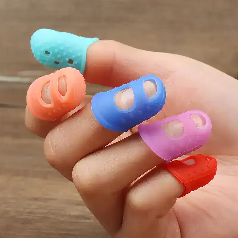 Colorful silicone finger protectors for improved grip in healthcare and optical work, designed to keep fingers safe and clean during delicate tasks.