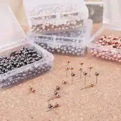 Colorful sewing pins with shiny metallic heads in plastic storage boxes, ideal for tailoring, dressmaking, and craft projects - Monalisa Store collection.