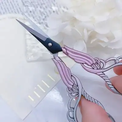 Elegant floral scissors for hair cutting, featuring pink and silver design, ideal for salon or personal grooming, showcased on a clean white background for professional hair styling tools.