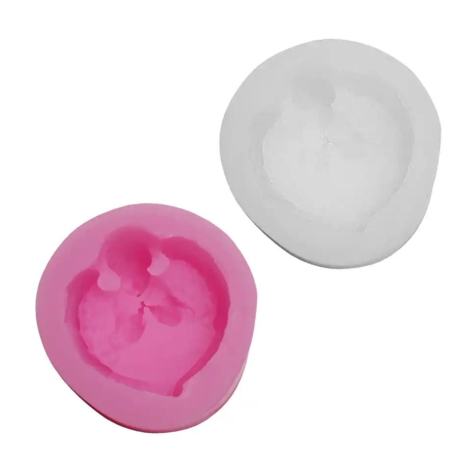 Silicone breast pump copies with heart-shaped design, used for breast milk expression, in pink and white colors. Perfect for new mothers seeking comfortable breastfeeding accessories.