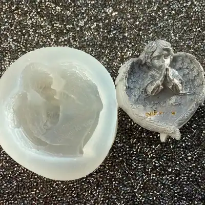 Heart-shaped soap with angel design and a detailed angel figurine on a textured black background, emphasizing premium quality and artistic craftsmanship for Monalisa Medical Store.