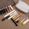 Assorted sewing and craft tools for DIY projects, including needles, thread, scissors, and measuring tools for personalized fabric and textile crafts.