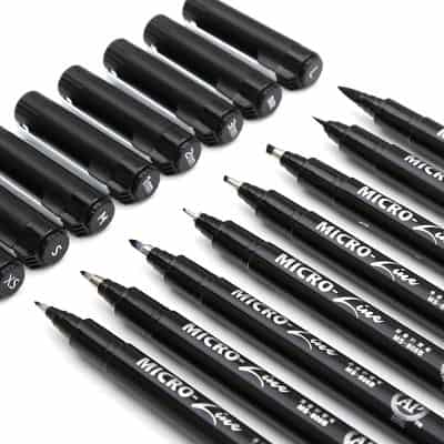 Fine tip black markers and pens for eyeglass lens engraving.