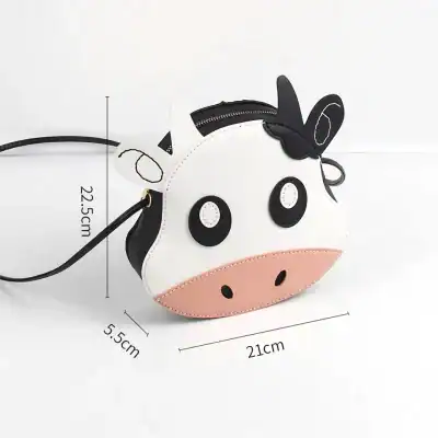 Cute cow-shaped handbag, perfect for kids and adults, made of soft faux leather, featuring adorable facial details, compact size 22.5cm x 21cm, ideal for casual outings and playful accessories.