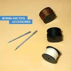 Colorful sewing awl tool accessories with spools of thread in brown, black, and white, and two sewing needles on a light yellow background perfect for textile and craft sewing projects.