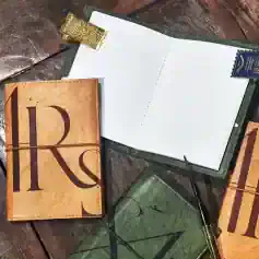 Leather travel journal with Monalisa Store branding, perfect for eye care appointments and notes.