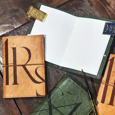 Leather travel journal with Monalisa Store branding, perfect for eye care appointments and notes.