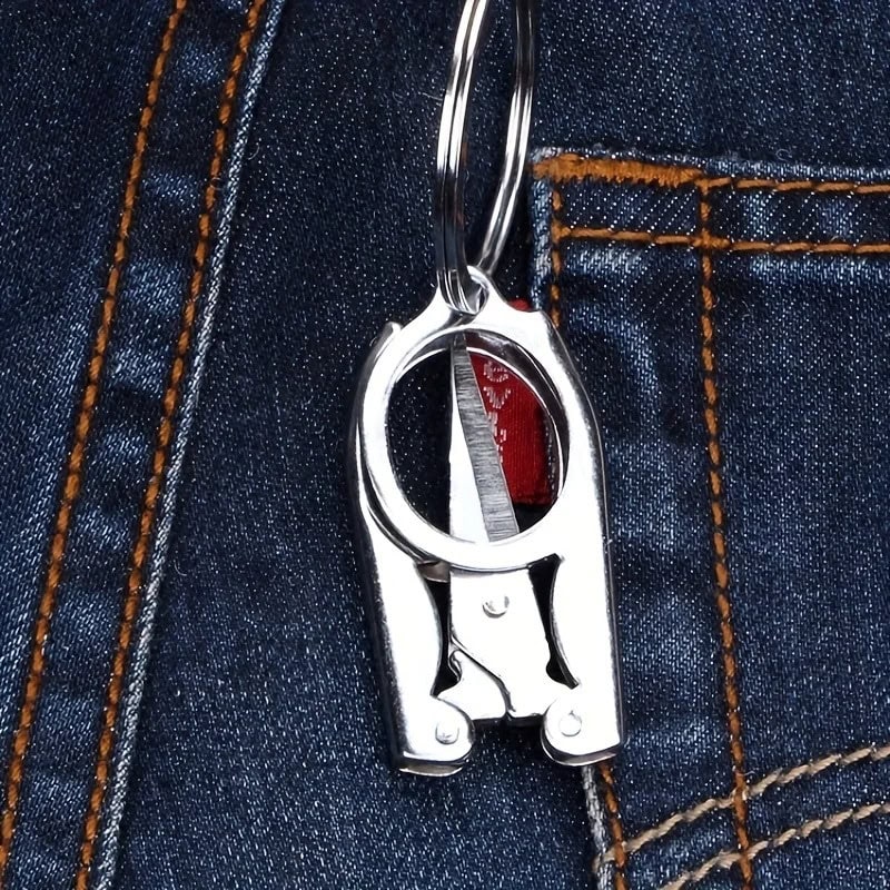 Metal keychain clip attached to denim pocket, fashion accessory for trendy street style, high-quality stainless steel, stylish and durable key holder, perfect for everyday use and personal organization.