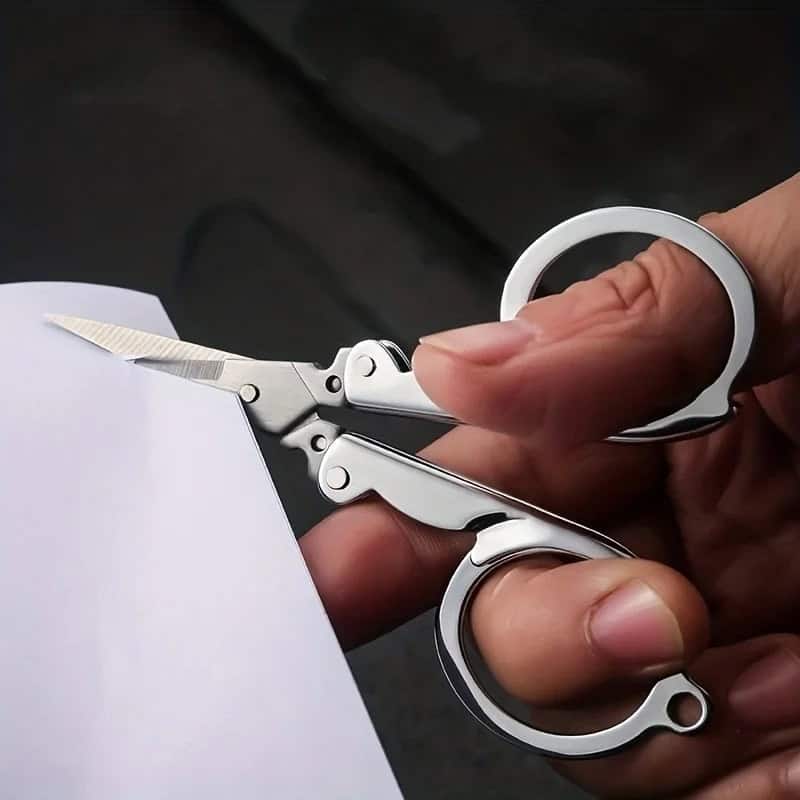 Stainless steel keychain scissors, compact and portable, ideal for cutting paper or small items, stylish and functional tool for everyday carry.