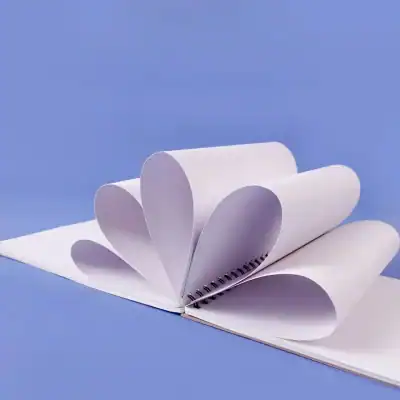 Blank white medical or notebook pages curled into a heart shape against a blue background, emphasizing health, medicine, or organization themes for Monalisa Store's opt services.
