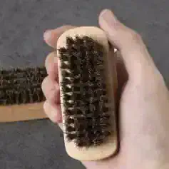 Brush with natural boar bristles for effective cleaning and grooming, ideal for skincare and beauty routines. Perfect for brushing hair or skin to promote circulation and healthy appearance.
