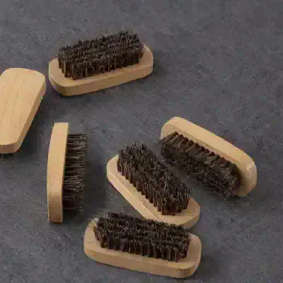 Shoe cleaner brushes with wooden handles for maintaining and polishing footwear, ideal for daily shoe care routines.