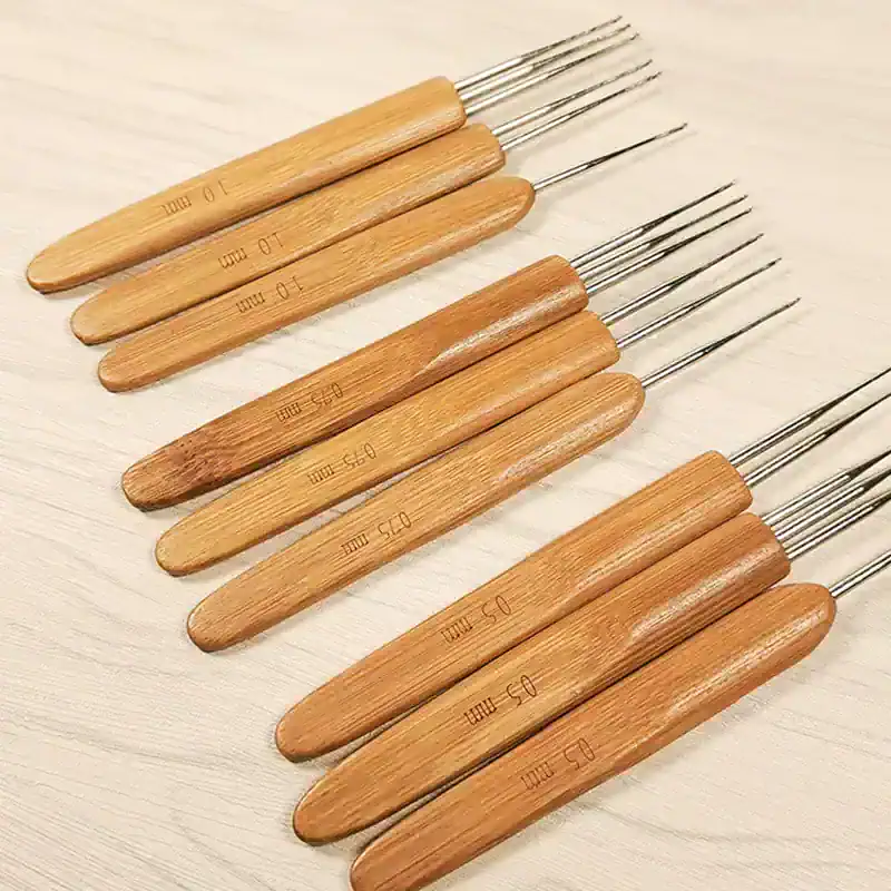 Ultrasound probe cleaning tools with wooden handles and metal tips for precise ultrasound instrument maintenance.