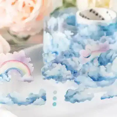 Cloud-themed decorative tape with pastel rainbows and clouds, ideal for crafts or scrapbooking.