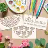 Delicate paper cutouts with floral and leaf patterns, art supplies, and motivational quote on a craft table. Perfect for home decor, crafting, or DIY projects by Monalisa Store.