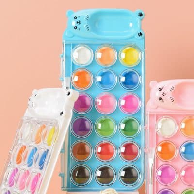 Bright colorful paint palette with cute animal-shaped caps, perfect for children's art supplies or playful cosmetic packaging, on a pastel background.