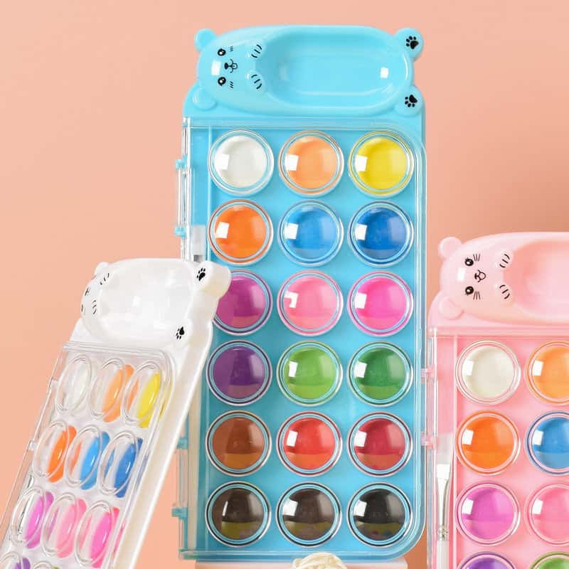 Bright colorful paint palette with cute animal-shaped caps, perfect for children's art supplies or playful cosmetic packaging, on a pastel background.