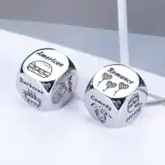 Shaped silver dice with icons and words for American cuisine, barbecue, French, romance, comedy, and hyena, ideal for food lovers and entertainment themes.