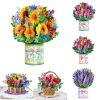 Sunflower and mixed flower paper bouquet in decorative container, perfect for floral decor and gift arrangements.
