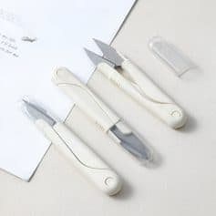 Surgical scalpels and precision blades with white handles, sterilized for medical use, displayed on a white surface at Monalisa Store.