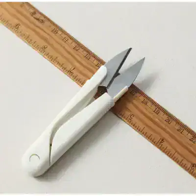 Precision surgical scalpel with white handle and stainless steel blades, ideal for delicate medical procedures and eye care treatments.