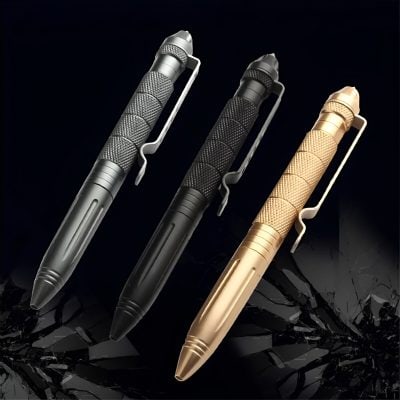 Black, silver, and gold tactical pens with textured grips and clip attachments, ideal for versatile writing and easy carry.