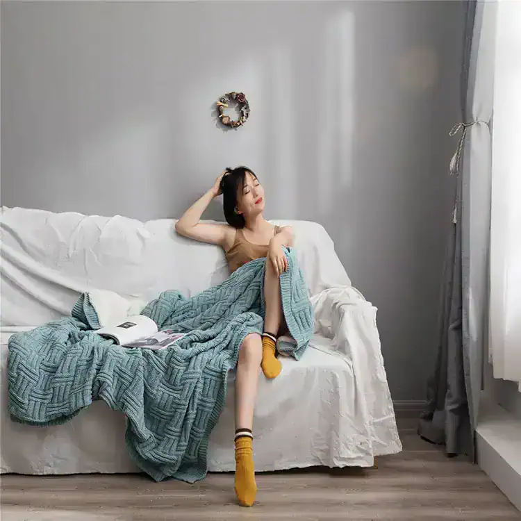 Comfortable woman relaxing on Monalisa Store sofa, blending modern aesthetic with cozy style, perfect for your skincare and aesthetic needs, with natural light enhancing a relaxing atmosphere.